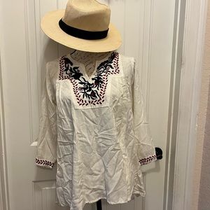 White top wrinkled due to wrong packing. Embroidered makes this tunic perfect